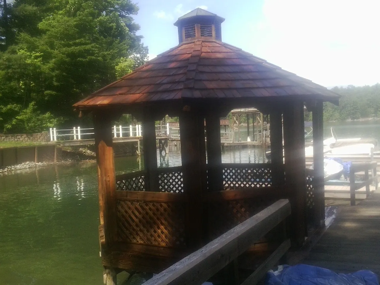 Cedar shake gazebo roof rebuilt on a lake dock in Arroyo Hondo